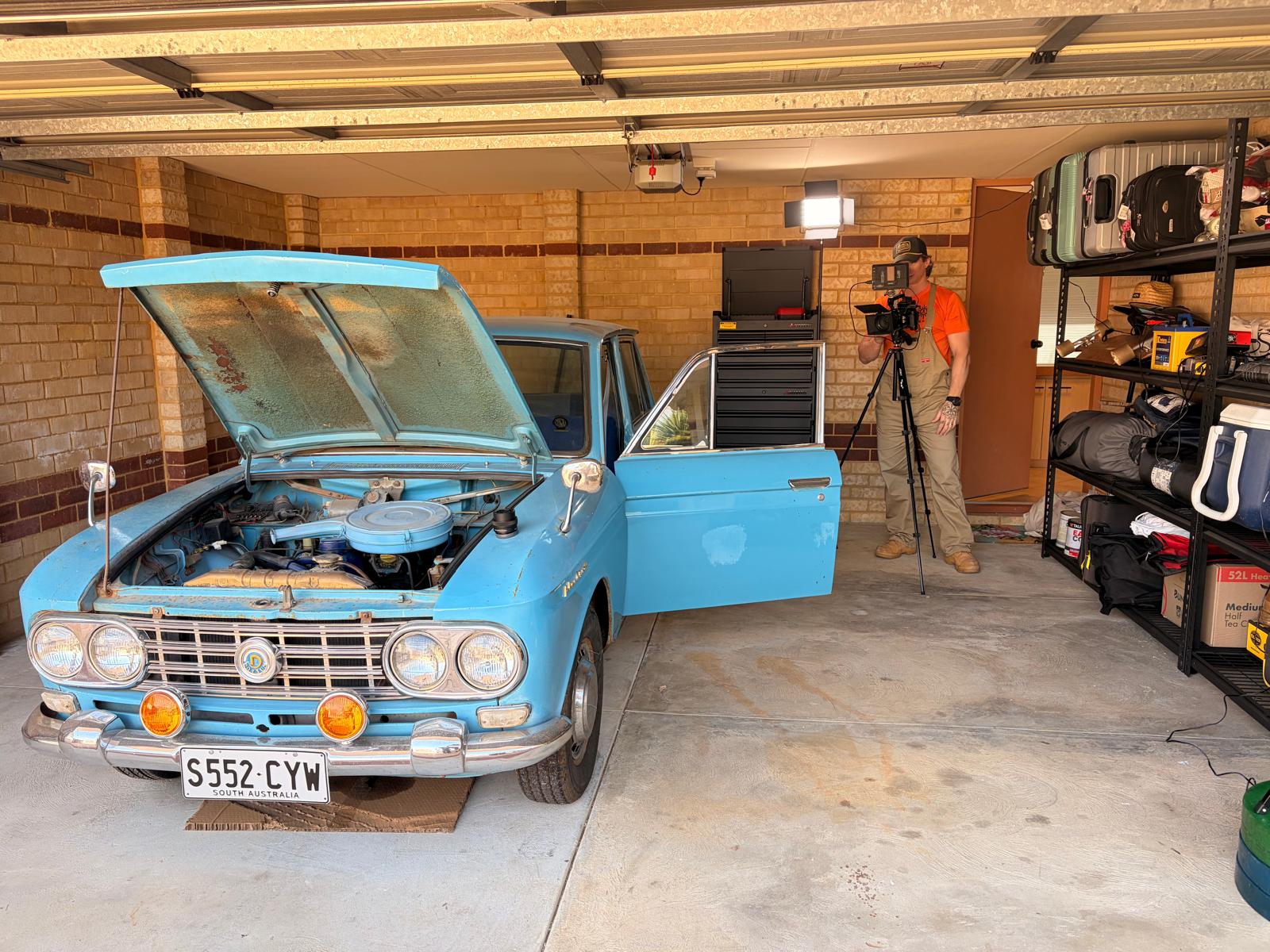 The blue Bluebird in Timmy's garage, set up for filming
